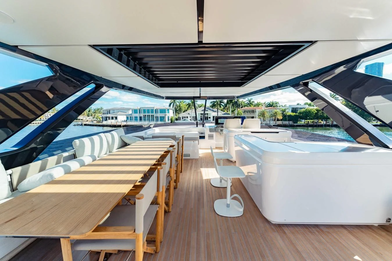 a deck with a pool and a deck with chairs aboard VITTORIA Yacht for Sale