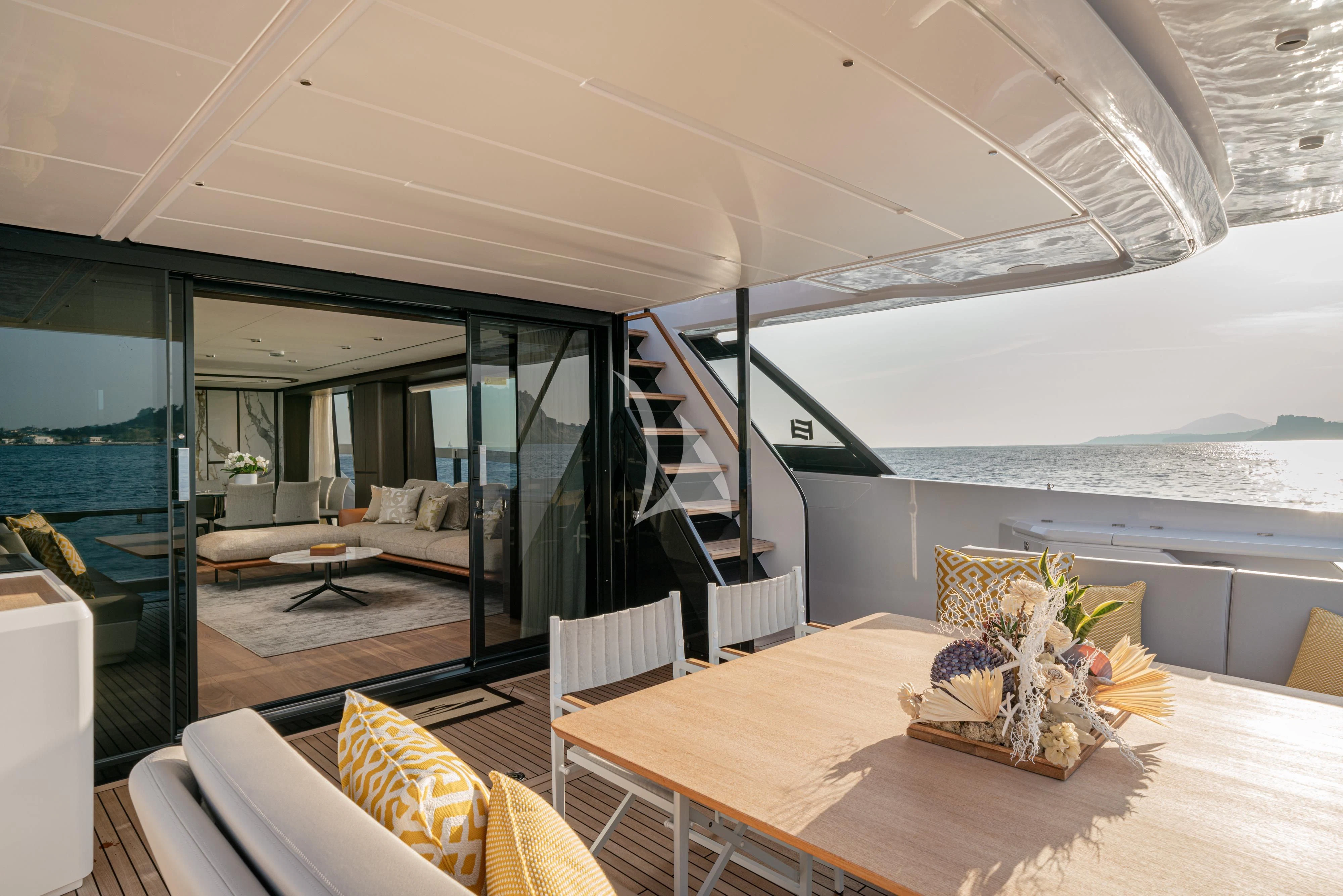 a room with a table and chairs aboard VITTORIA Yacht for Sale