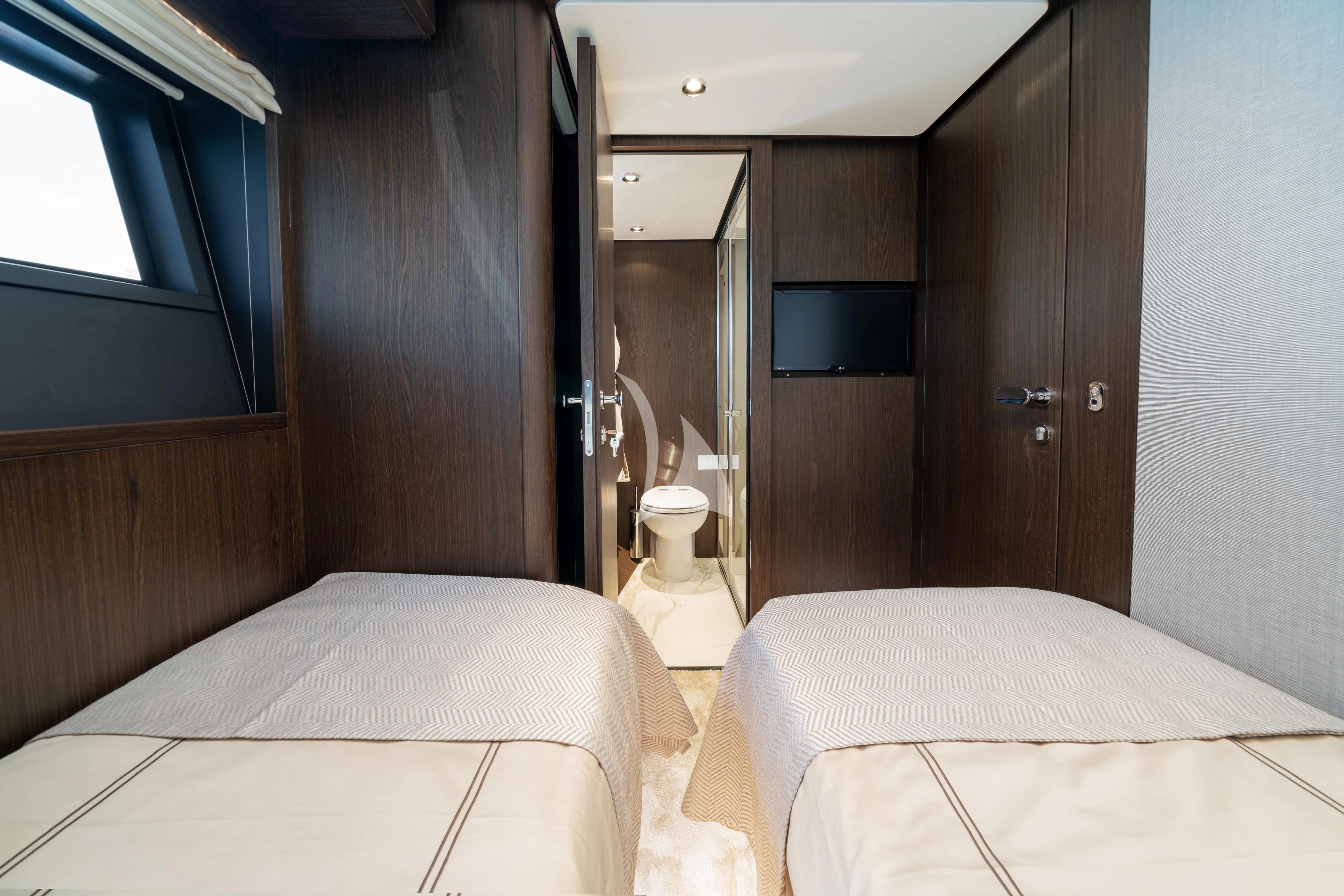 a room with two beds aboard VITTORIA Yacht for Sale