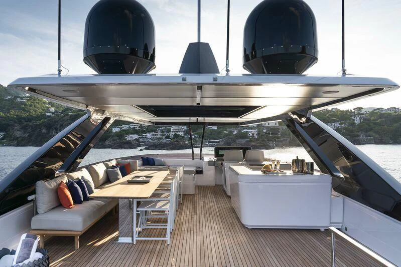 a deck with a large black and white boat on it aboard VITTORIA Yacht for Sale