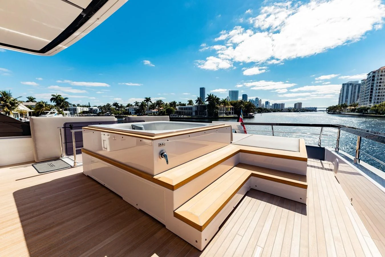 a deck with a view of a city and water aboard VITTORIA Yacht for Sale