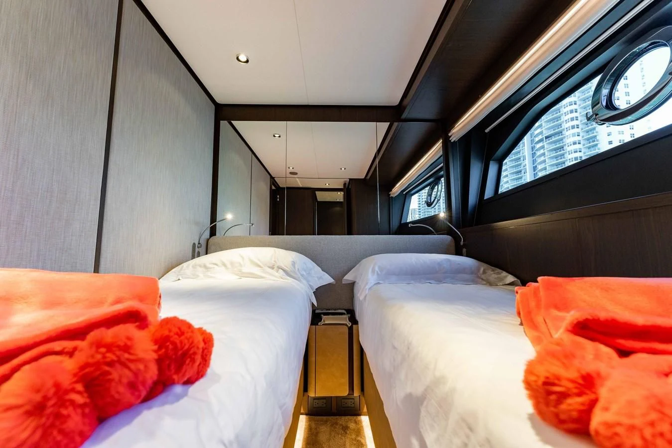 a room with beds and a window aboard VITTORIA Yacht for Sale