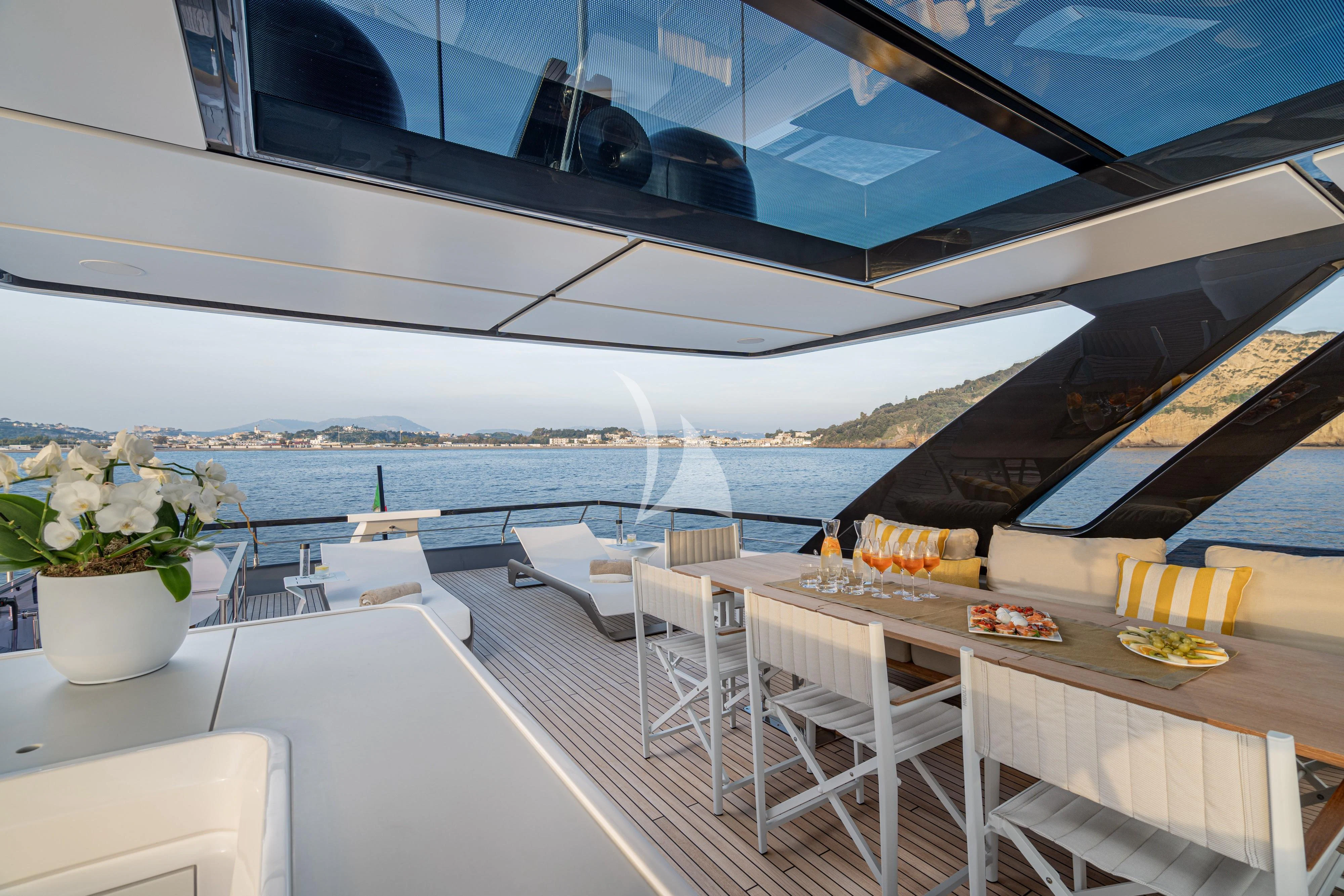 a room with tables and chairs aboard VITTORIA Yacht for Sale