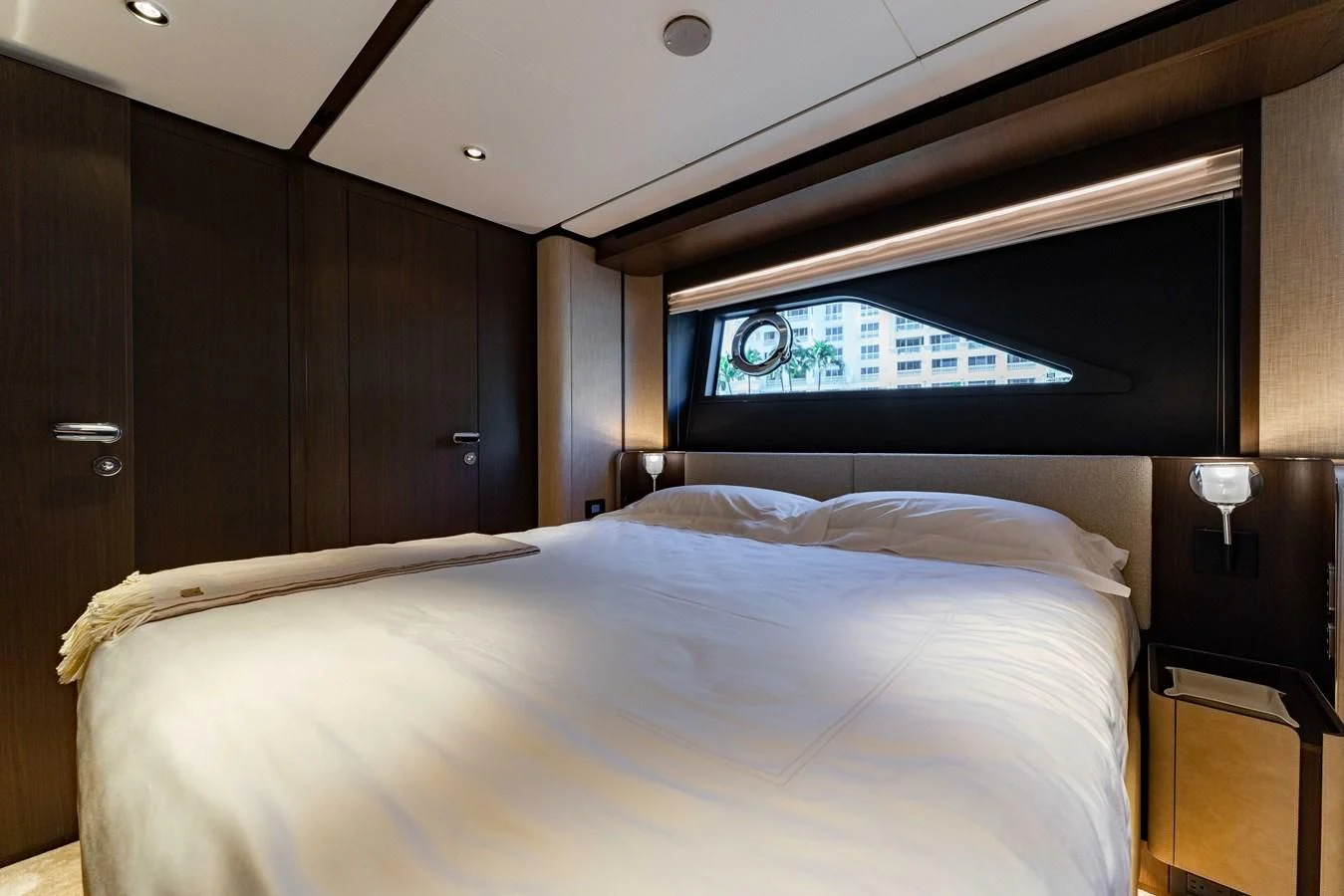 a bed with a white bed spread aboard VITTORIA Yacht for Sale