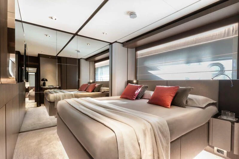 a room with a bed and a window aboard VITTORIA Yacht for Sale