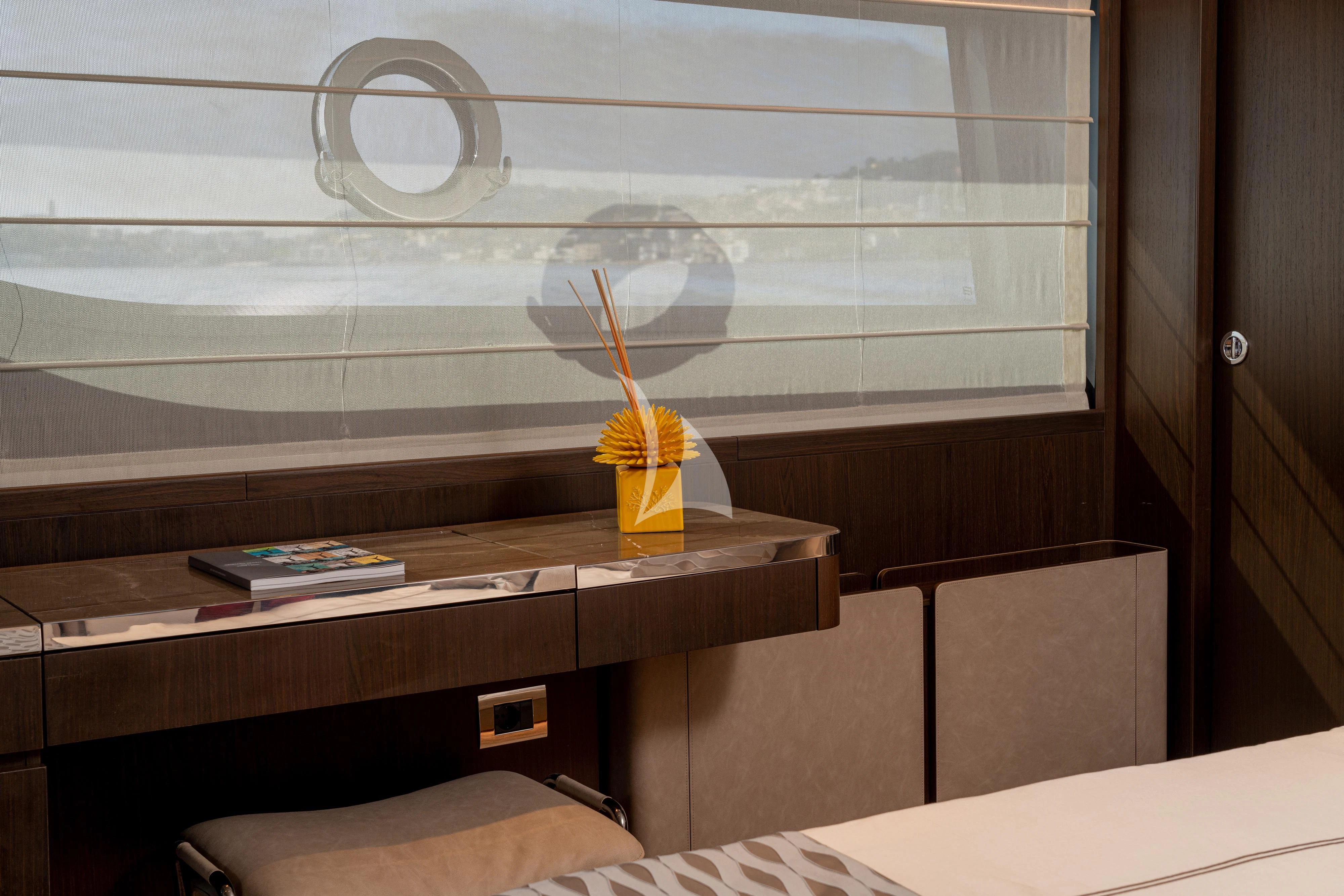 a glass cup with a straw on a table aboard VITTORIA Yacht for Sale