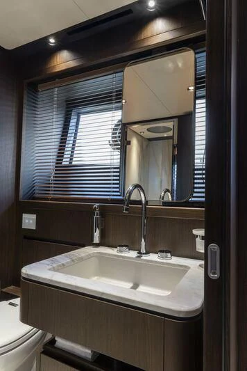 a bathroom with a sink and a mirror aboard VITTORIA Yacht for Sale