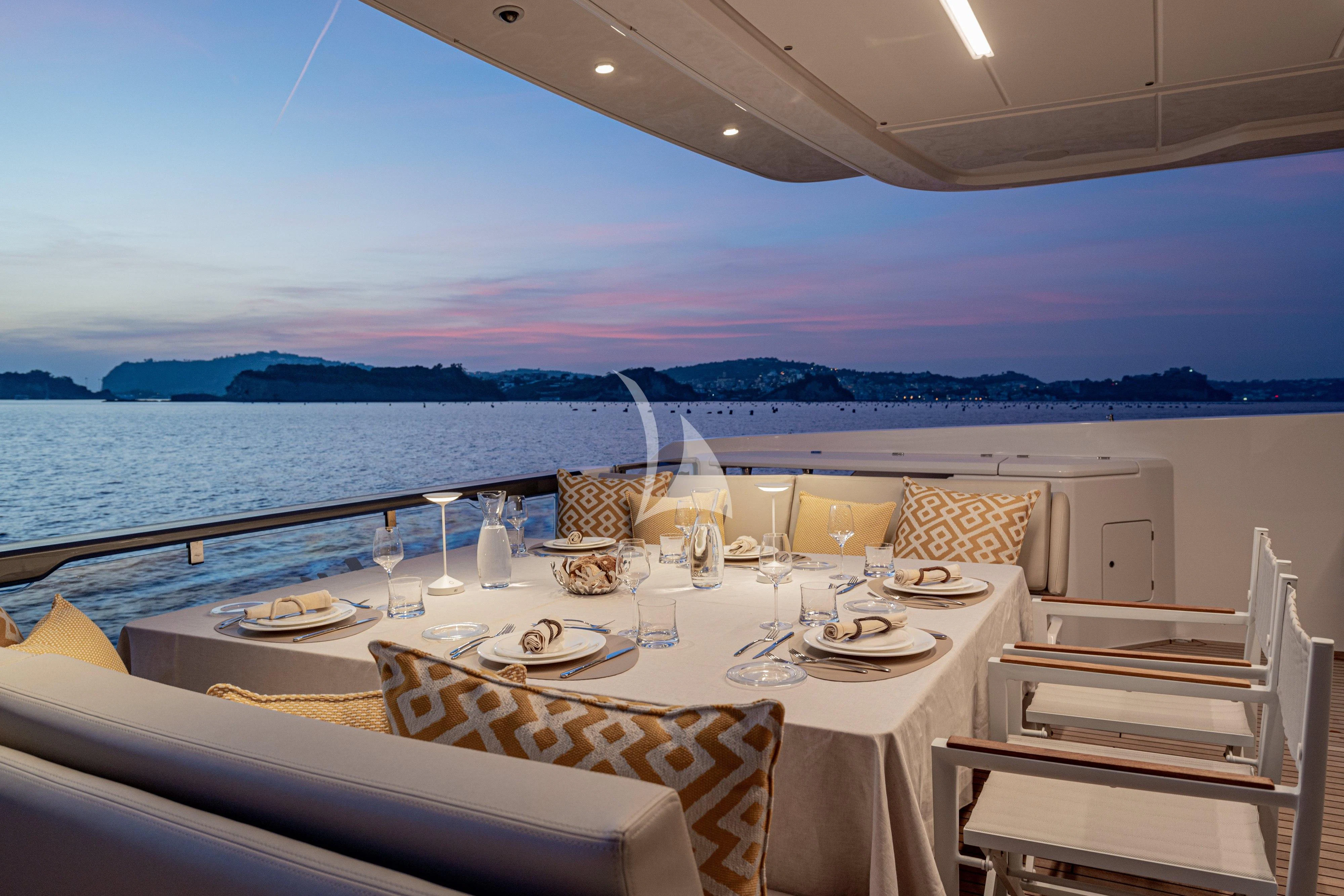 a table set for a dinner aboard VITTORIA Yacht for Sale