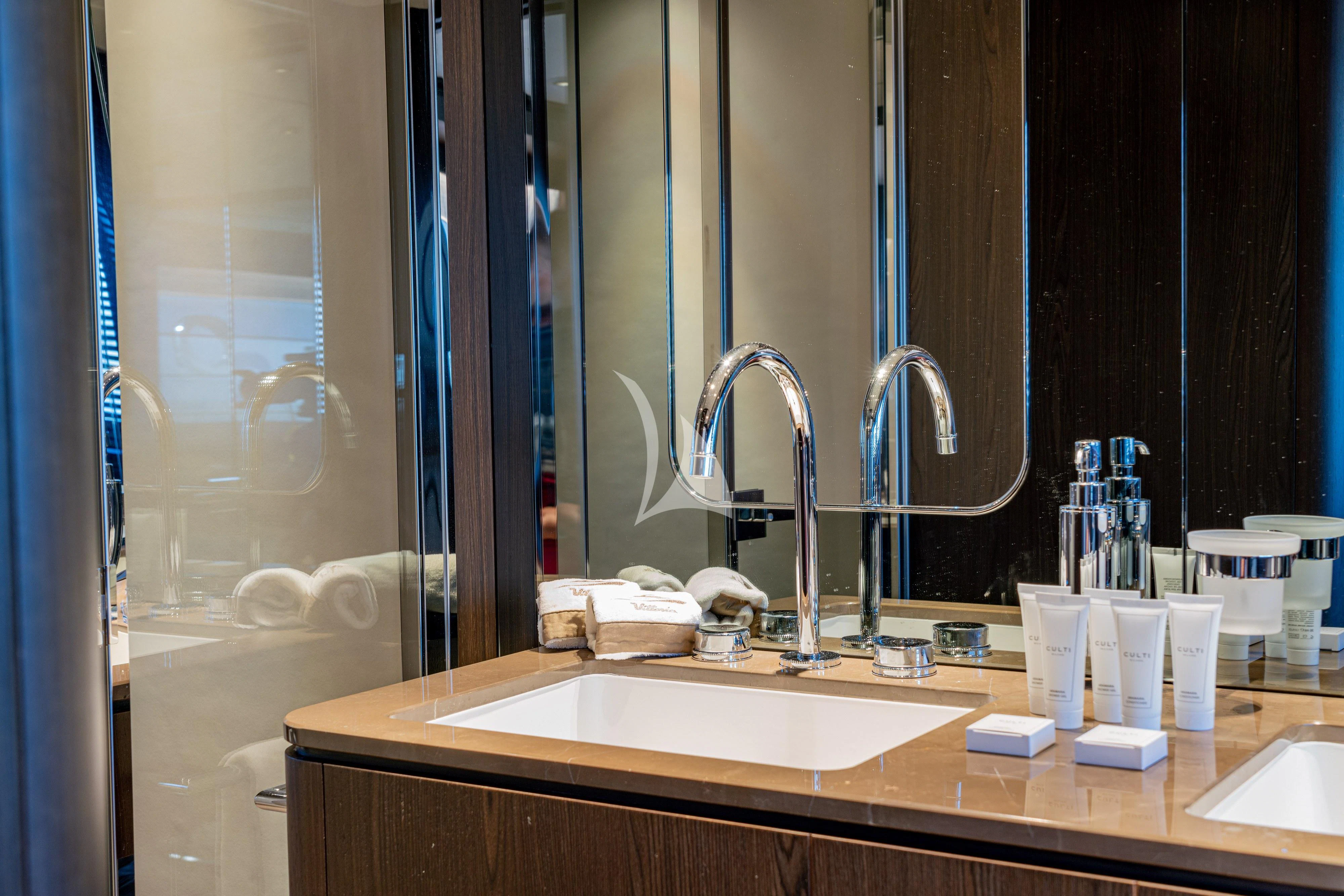 a bathroom with a sink and a bathtub aboard VITTORIA Yacht for Sale