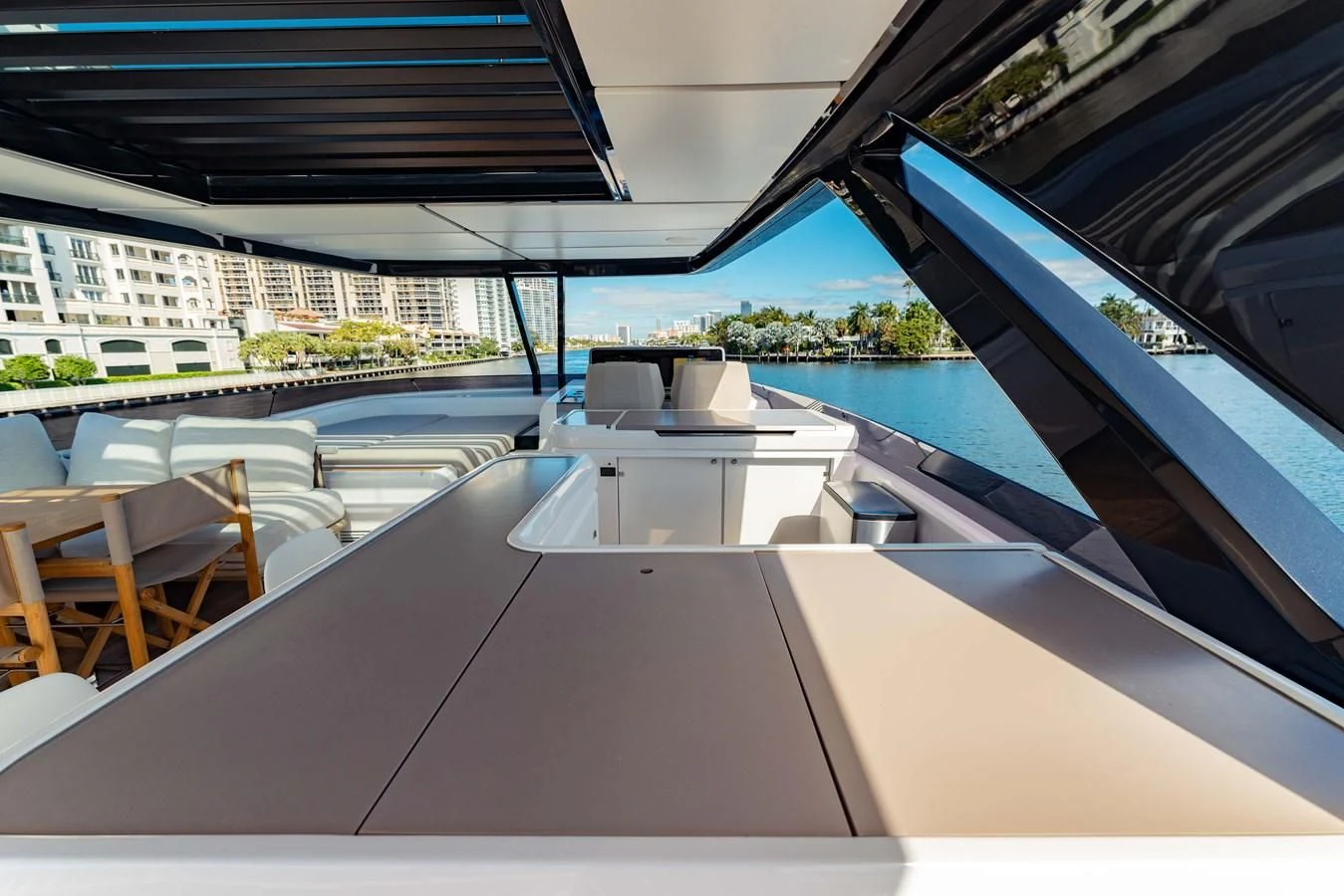 a pool with a deck and chairs aboard VITTORIA Yacht for Sale