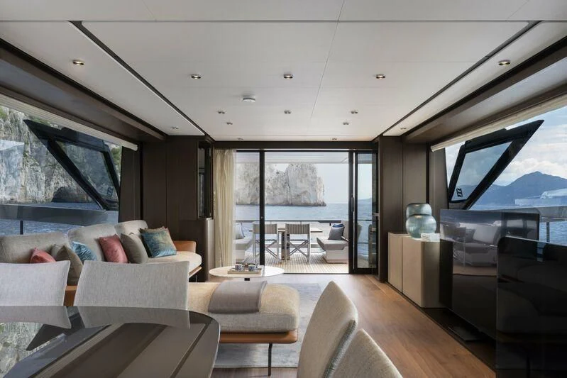 a living room with a large window aboard VITTORIA Yacht for Sale