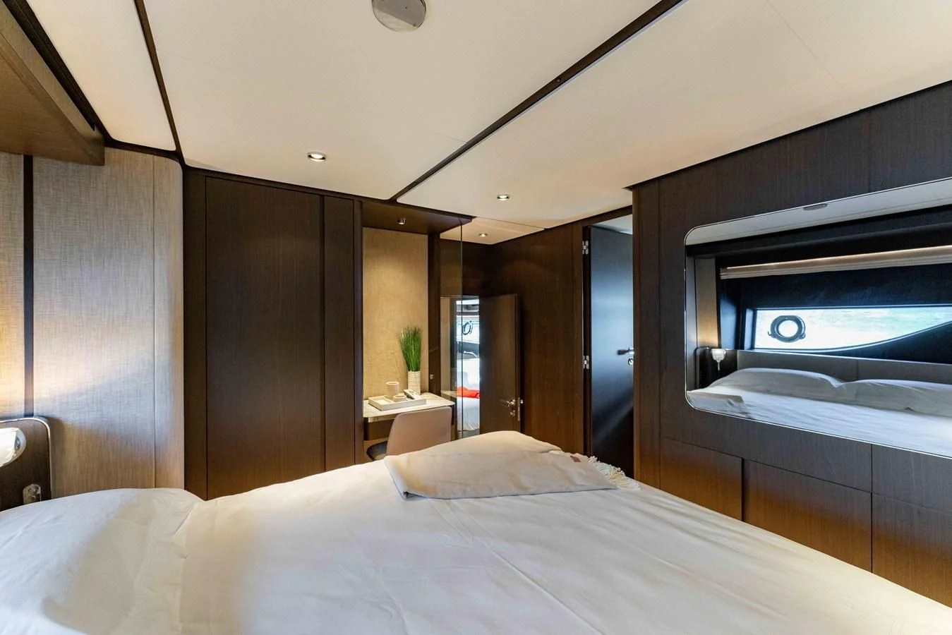 a bed with a white sheet aboard VITTORIA Yacht for Sale