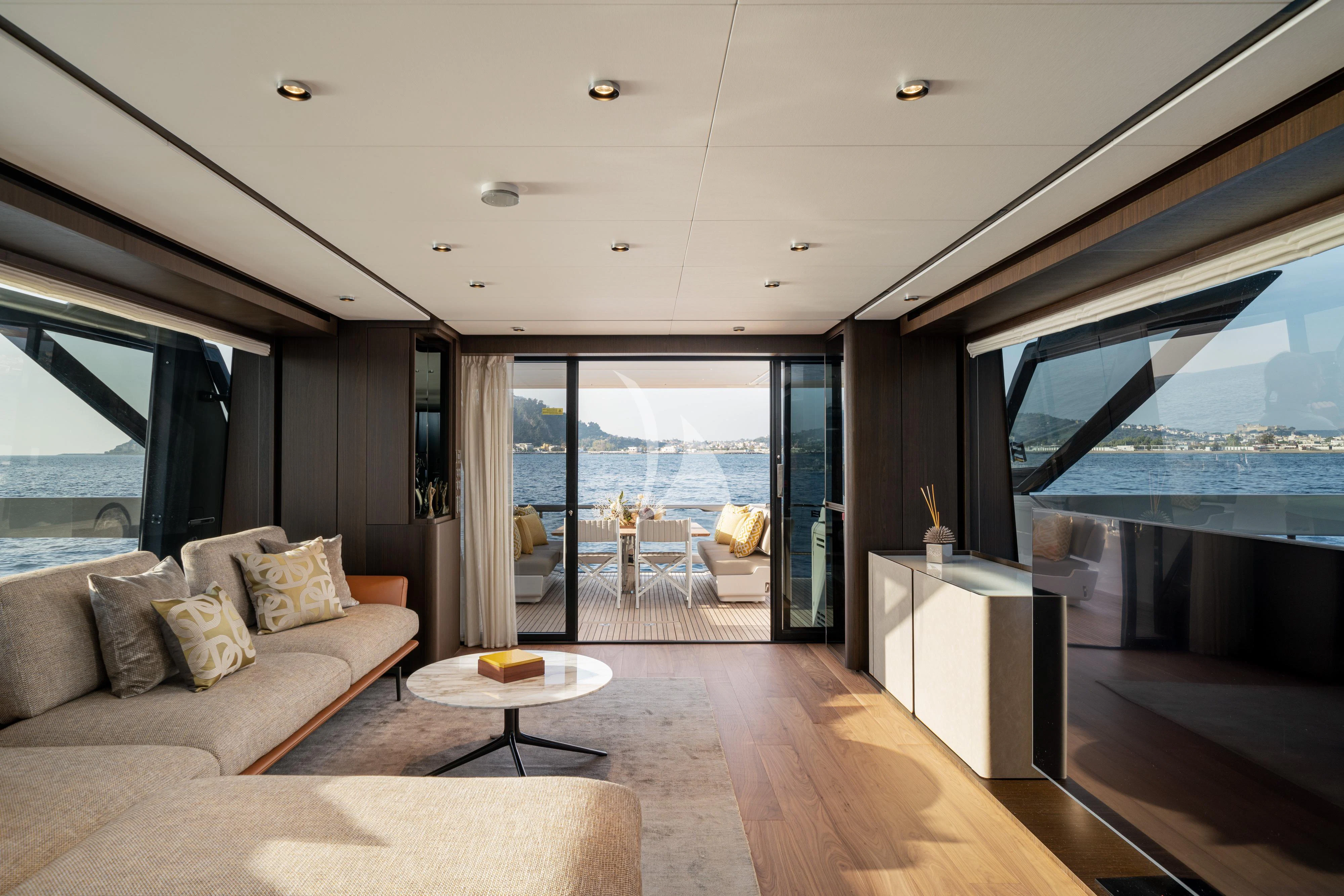 a living room with a large window aboard VITTORIA Yacht for Sale