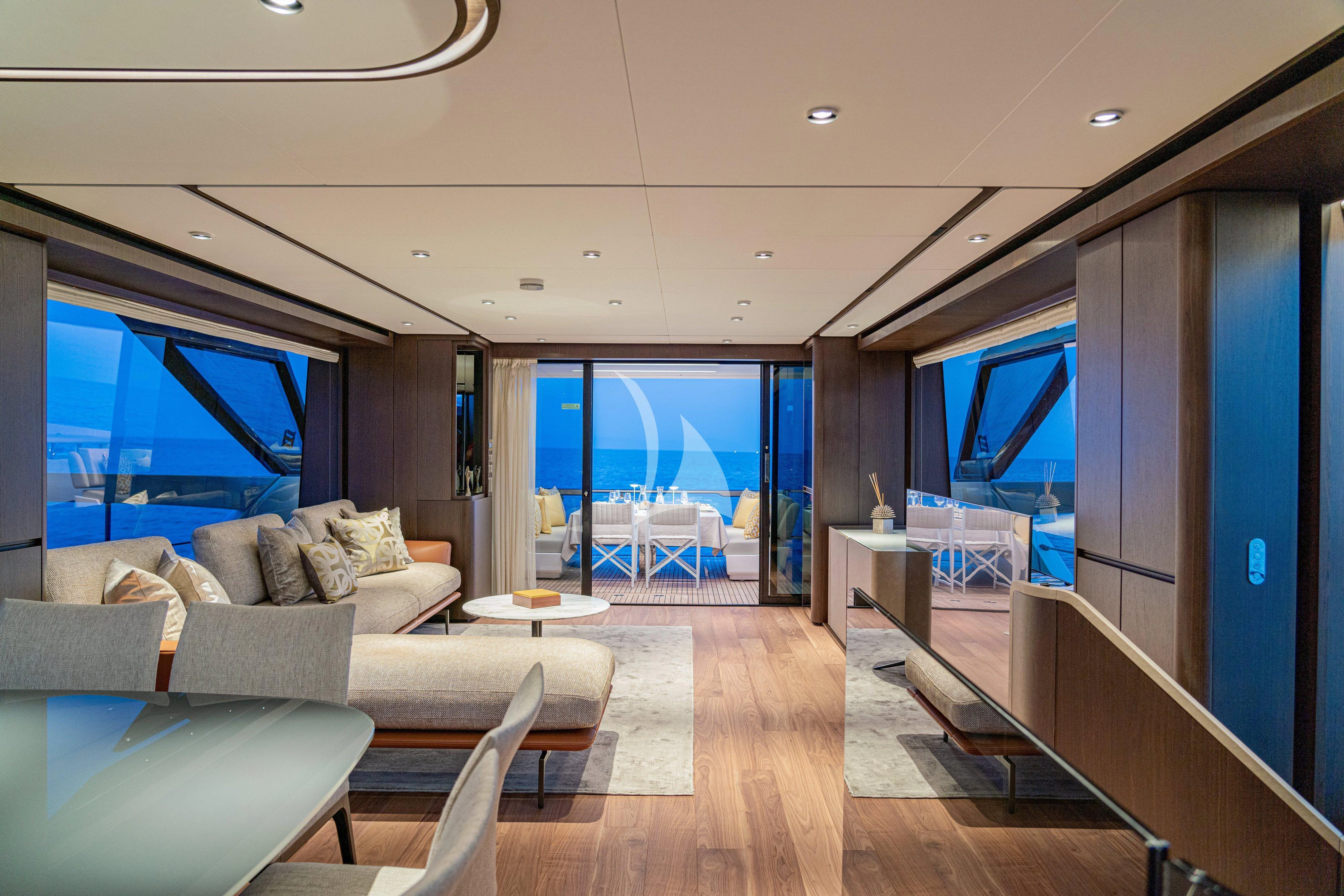 a living room with a large window aboard VITTORIA Yacht for Sale