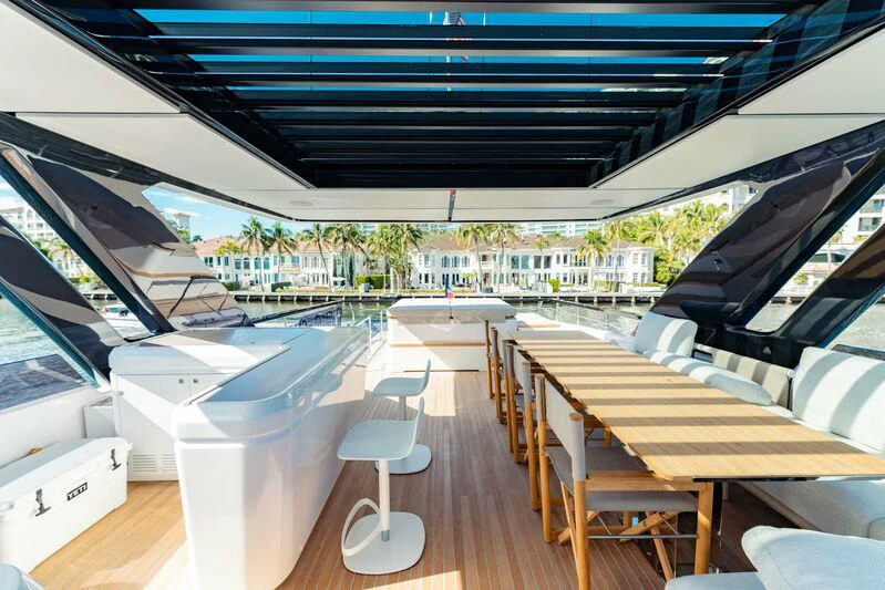 a deck with a deck and chairs aboard VITTORIA Yacht for Sale