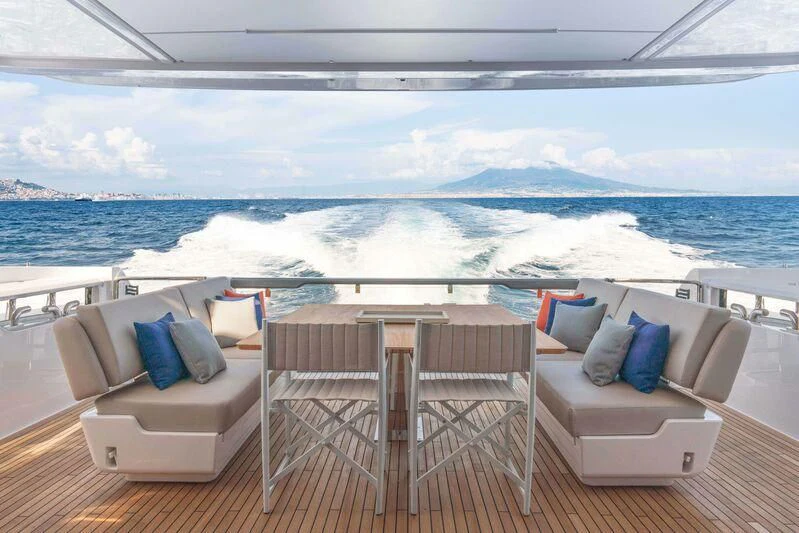 a room with chairs and a table aboard VITTORIA Yacht for Sale