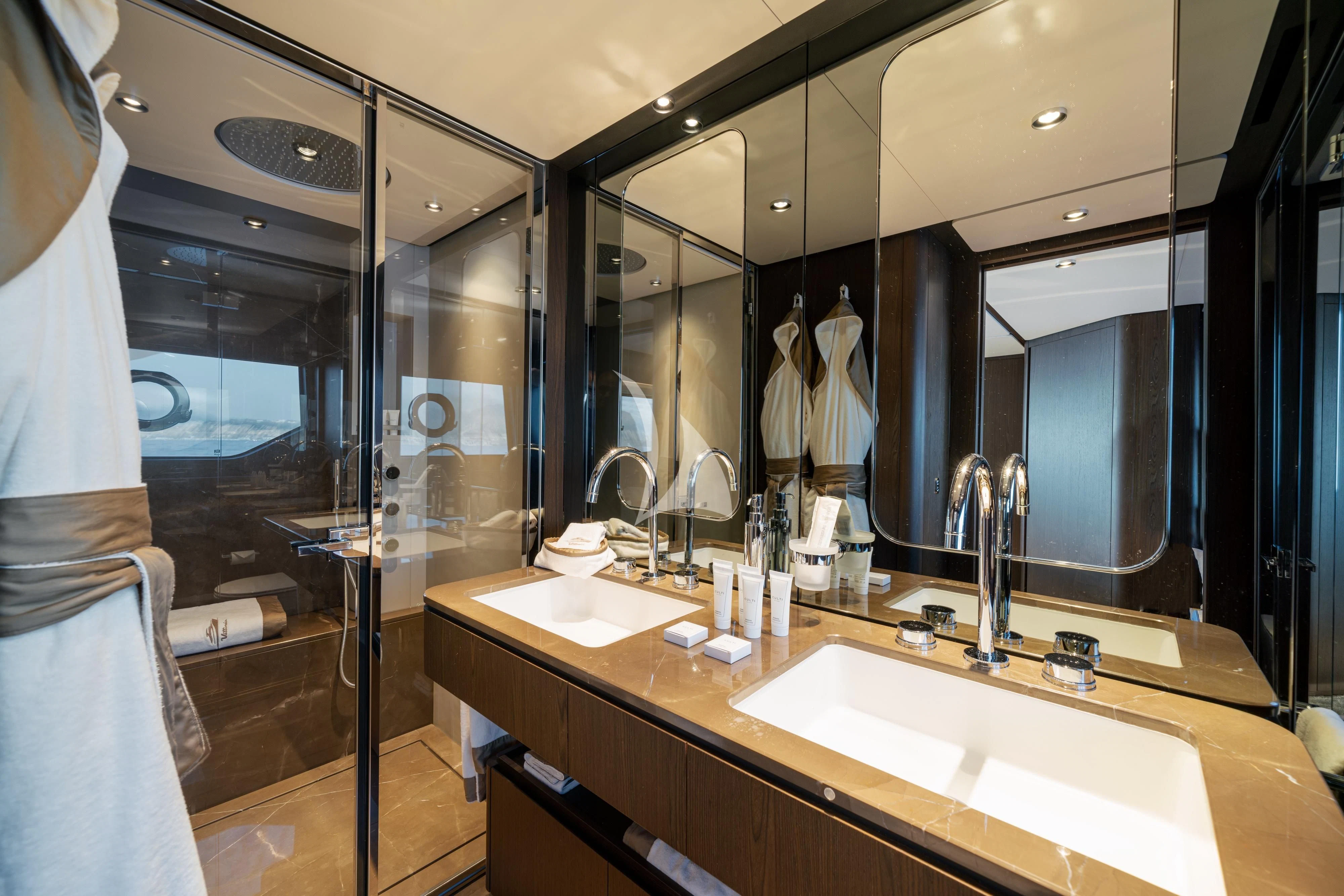 a bathroom with a large mirror aboard VITTORIA Yacht for Sale