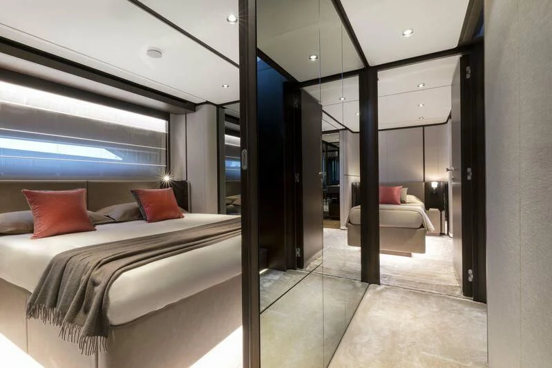 a room with a bed and a window aboard VITTORIA Yacht for Sale