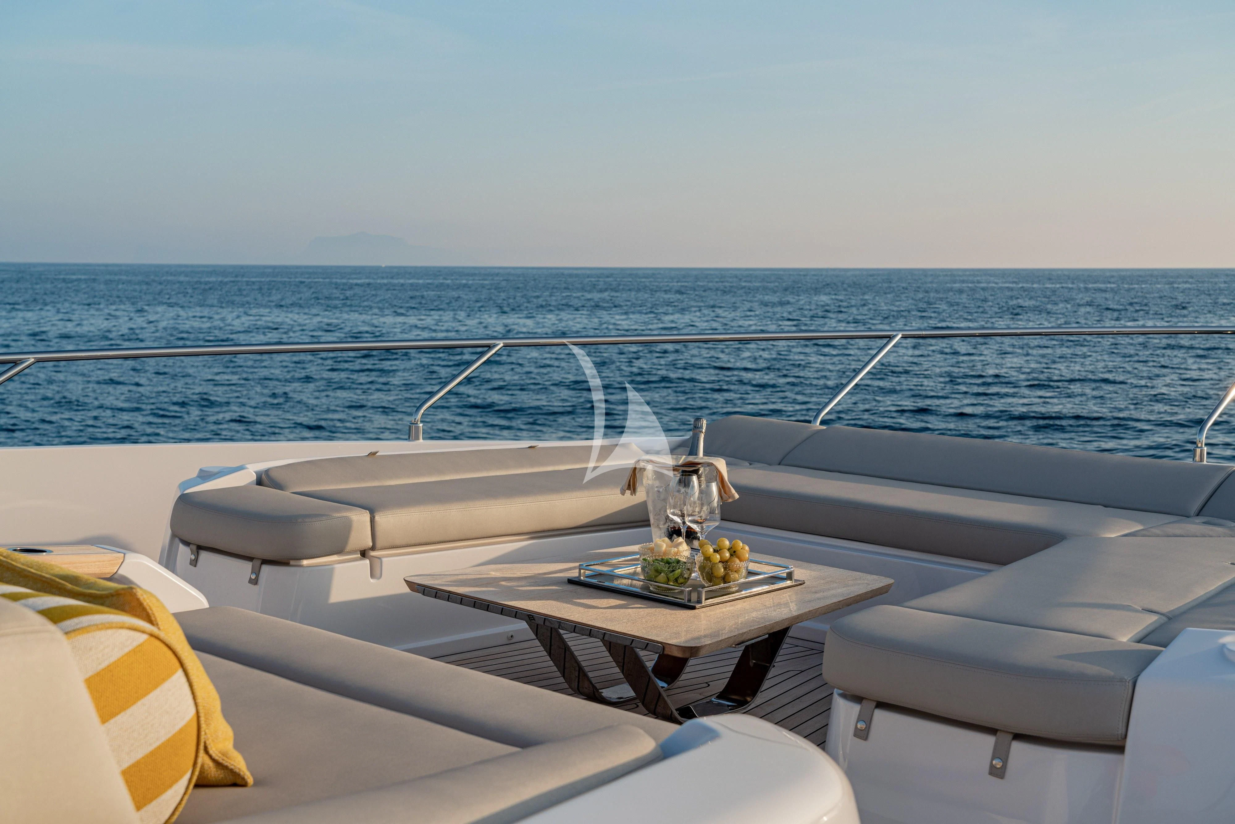 a boat with a table and a glass on the side aboard VITTORIA Yacht for Sale