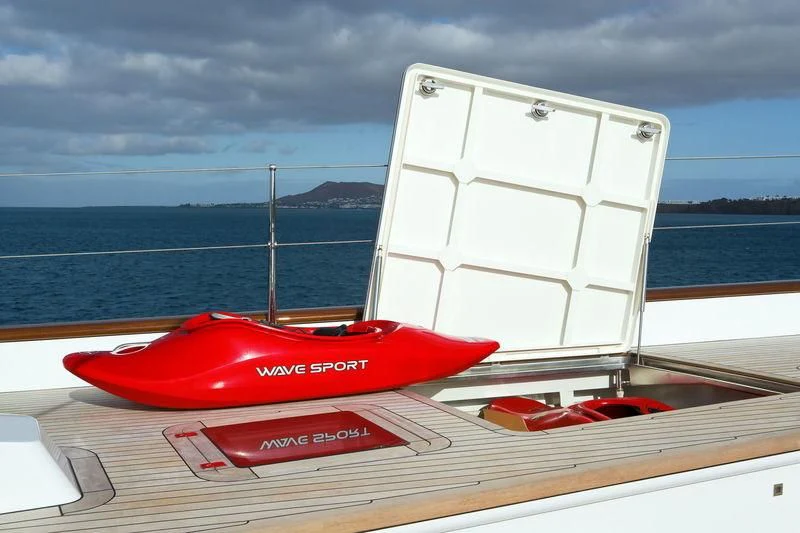 a red and white boat on a wooden surface aboard ETHEREAL Yacht for Sale