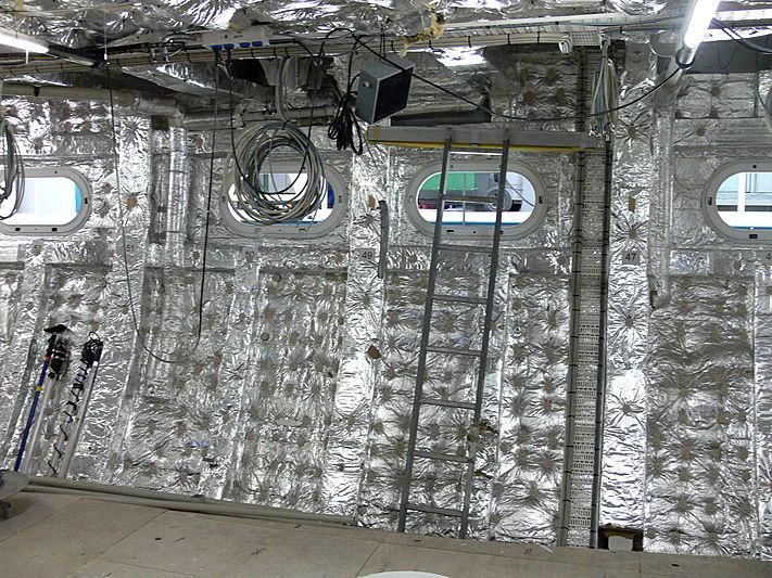 a room with a wall of pipes and equipment aboard ETHEREAL Yacht for Sale