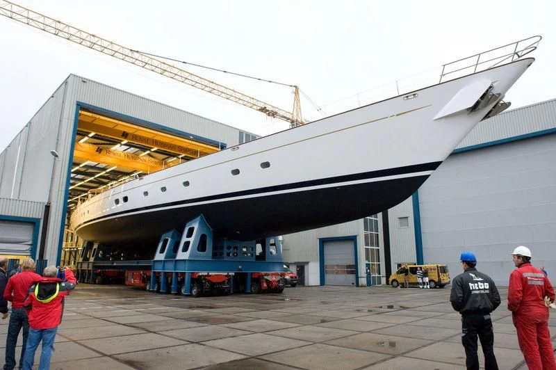 a group of people standing outside a building aboard ETHEREAL Yacht for Sale
