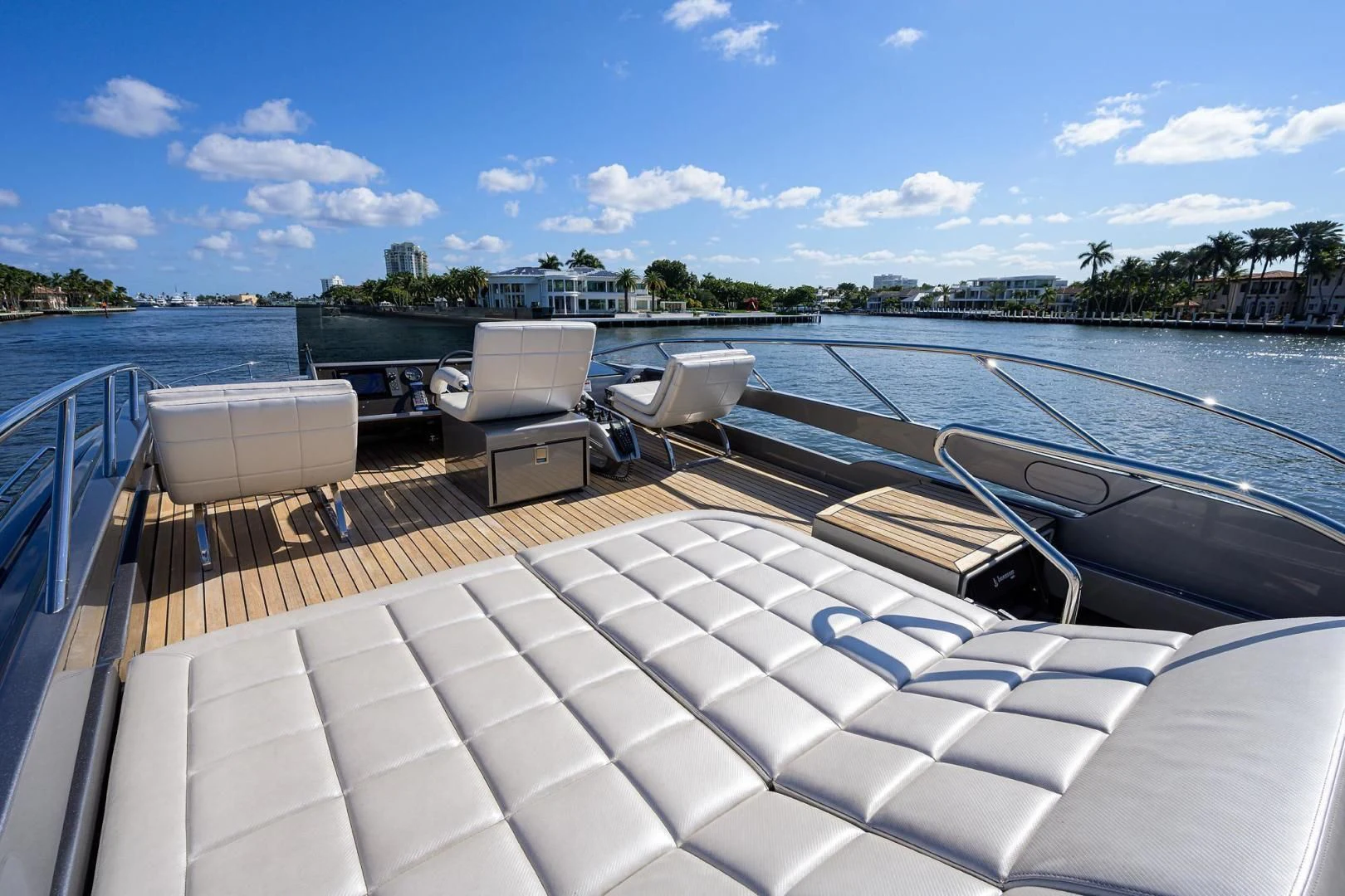 a deck with chairs and a table on it aboard AFRICAN WILD DOG Yacht for Sale