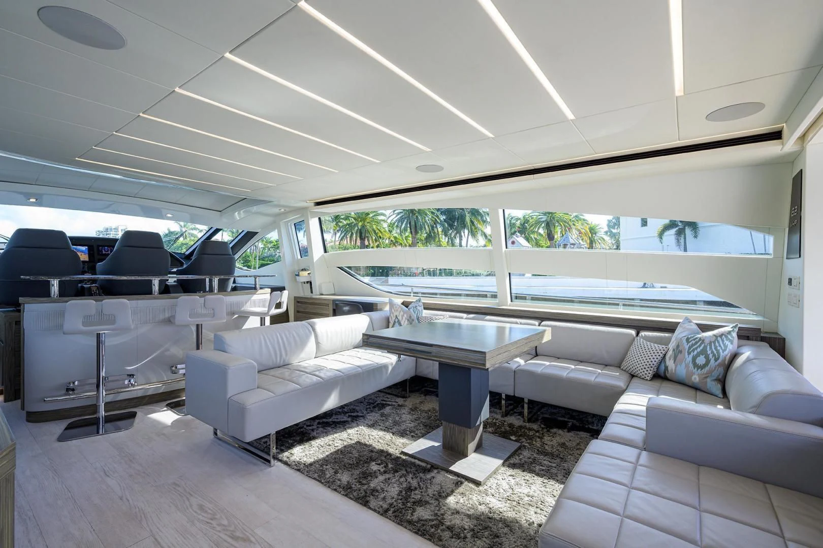 a living room with a couch and a table aboard AFRICAN WILD DOG Yacht for Sale