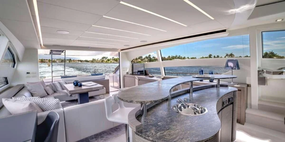 a living room with a large table and chairs aboard AFRICAN WILD DOG Yacht for Sale