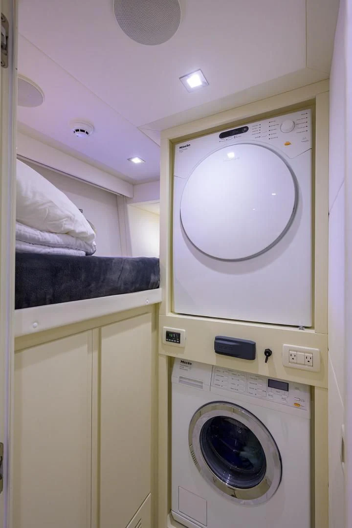 a washing machine in a room aboard AFRICAN WILD DOG Yacht for Sale
