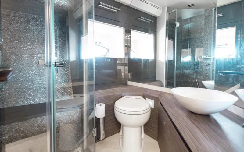 a bathroom with a glass shower aboard AFRICAN WILD DOG Yacht for Sale