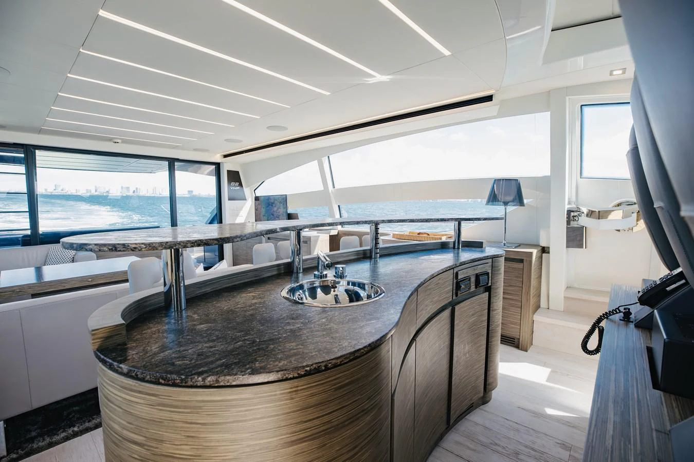 a large room with a table and chairs aboard AFRICAN WILD DOG Yacht for Sale