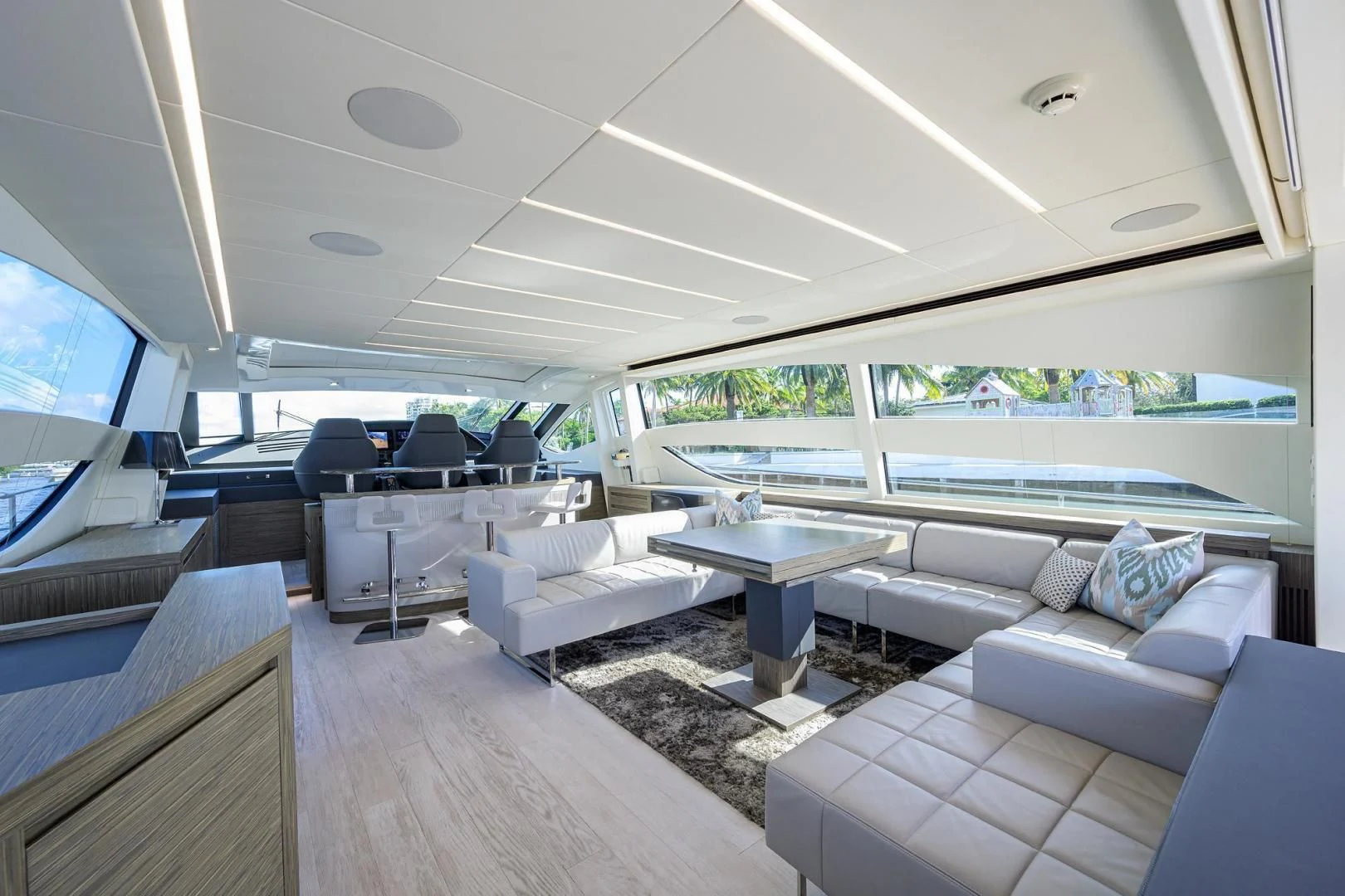 a room with a table and couches aboard AFRICAN WILD DOG Yacht for Sale