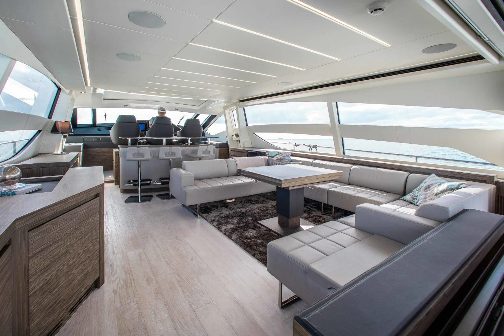 a room with a couch and a table and a window aboard AFRICAN WILD DOG Yacht for Sale