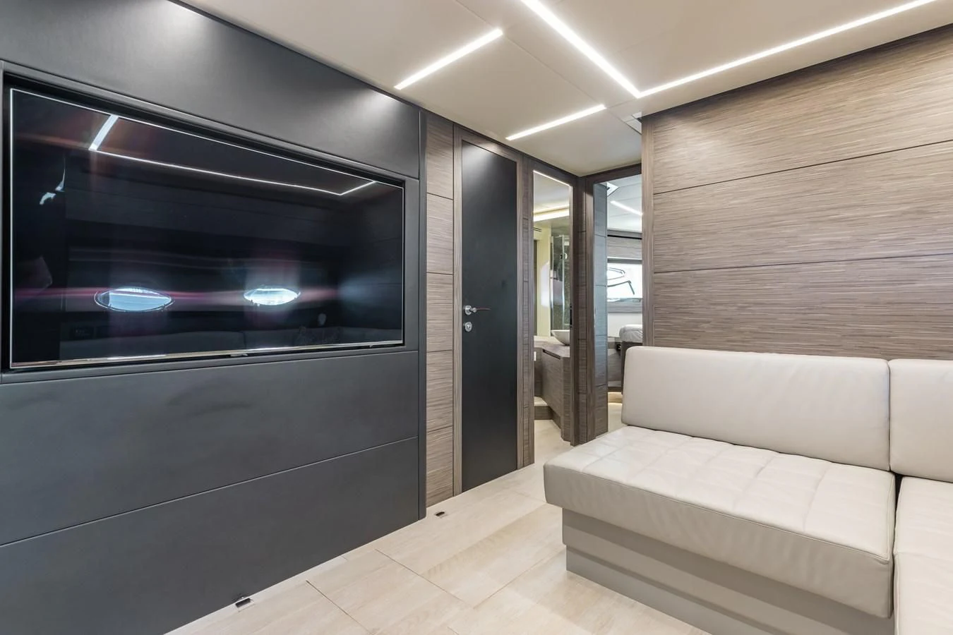 a room with a couch and a fireplace aboard AFRICAN WILD DOG Yacht for Sale