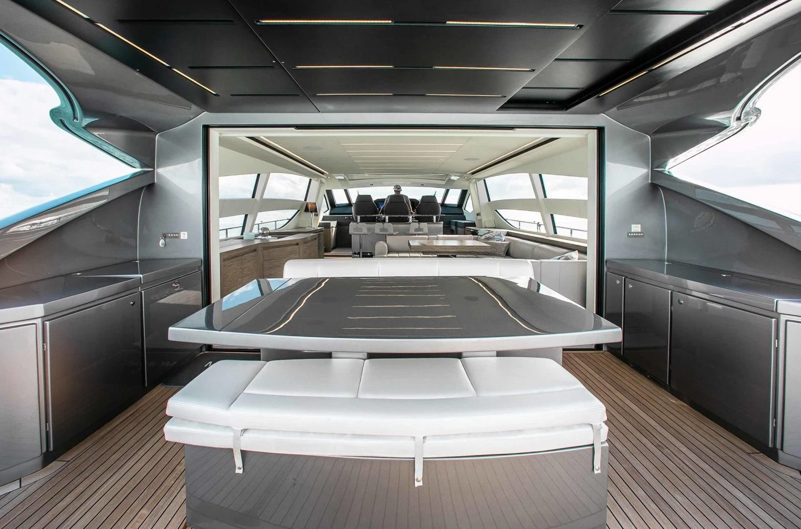 a room with a table and chairs aboard AFRICAN WILD DOG Yacht for Sale