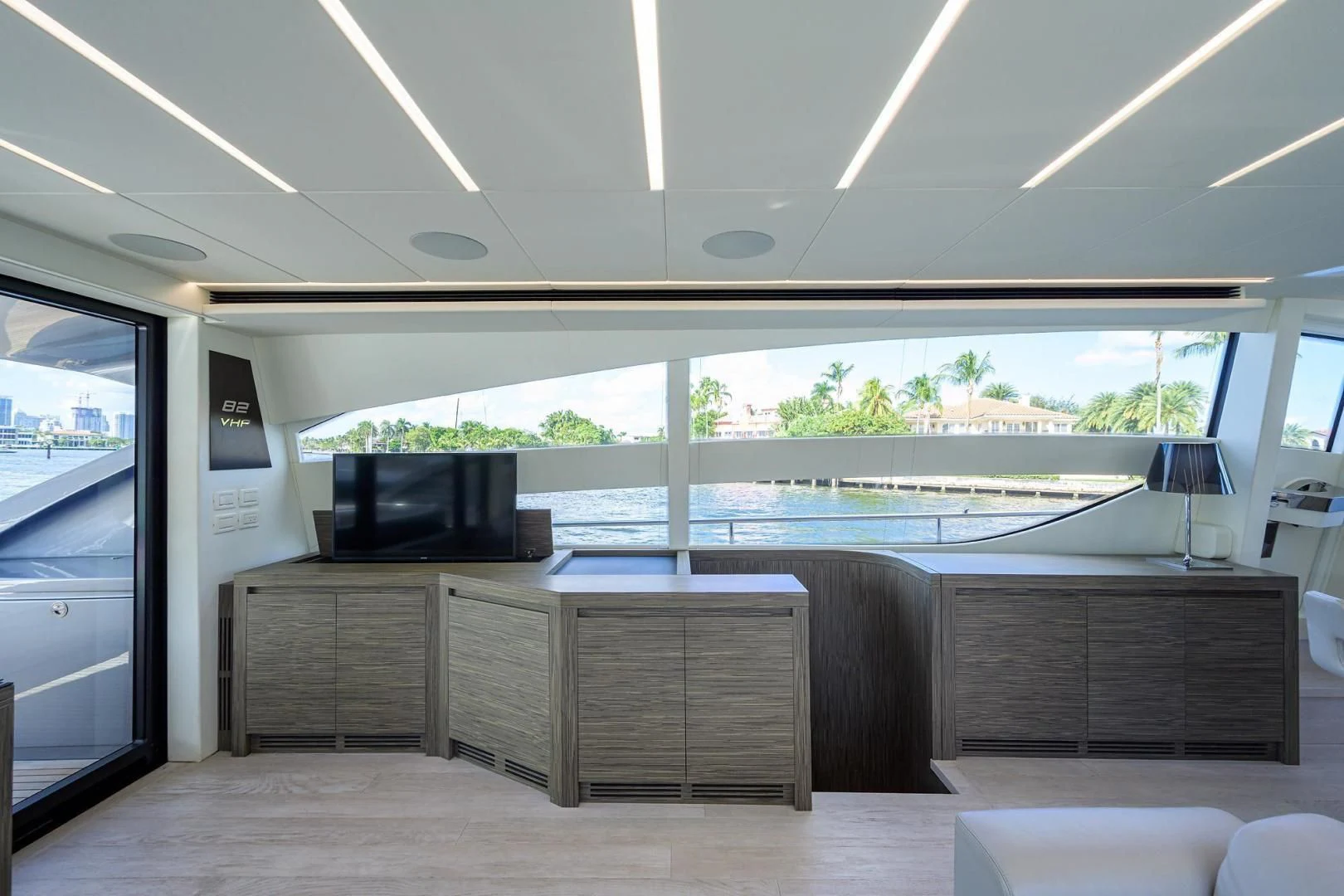 a room with a large window and a large screen aboard AFRICAN WILD DOG Yacht for Sale