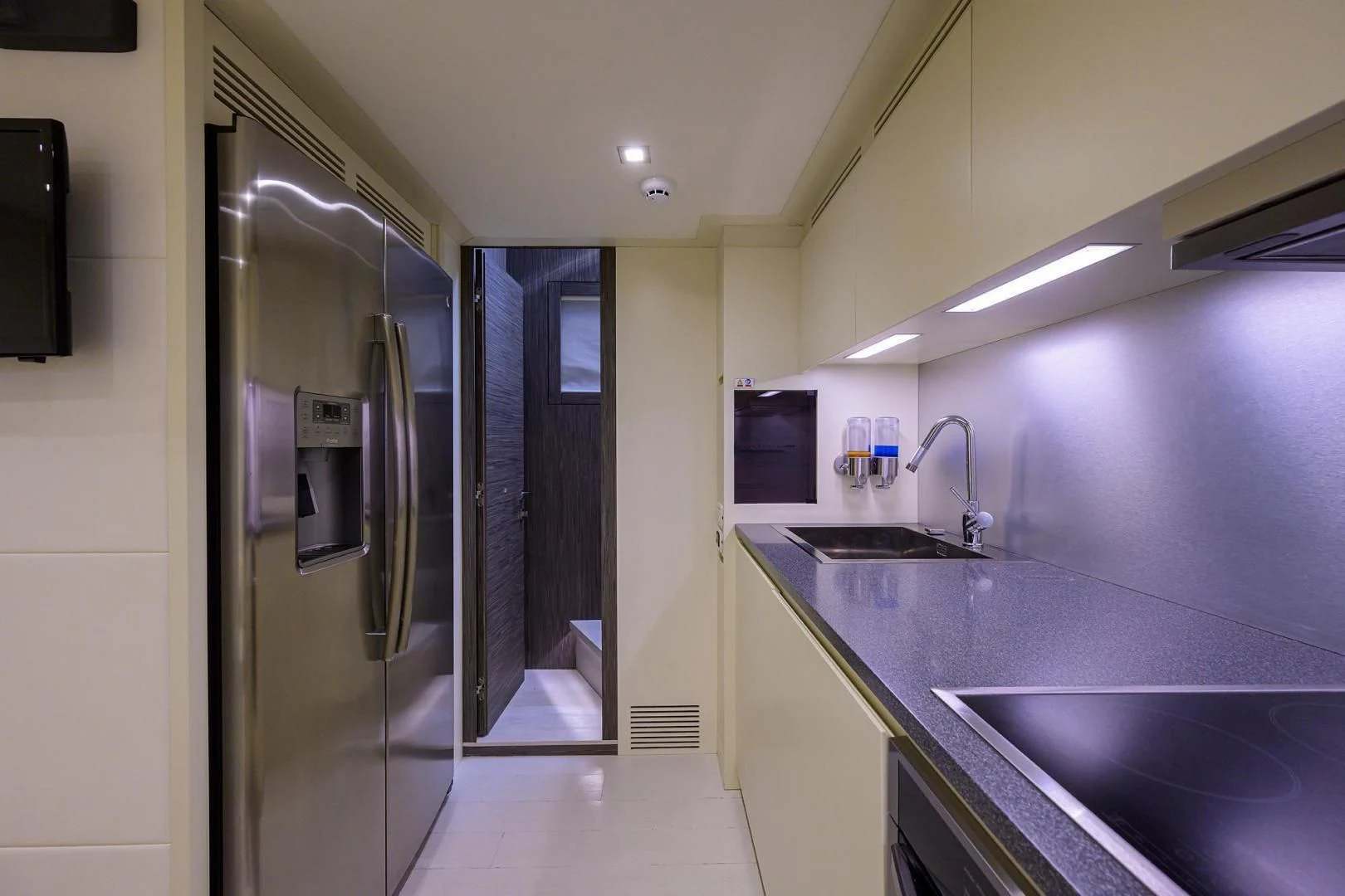 a kitchen with a stainless steel sink aboard AFRICAN WILD DOG Yacht for Sale