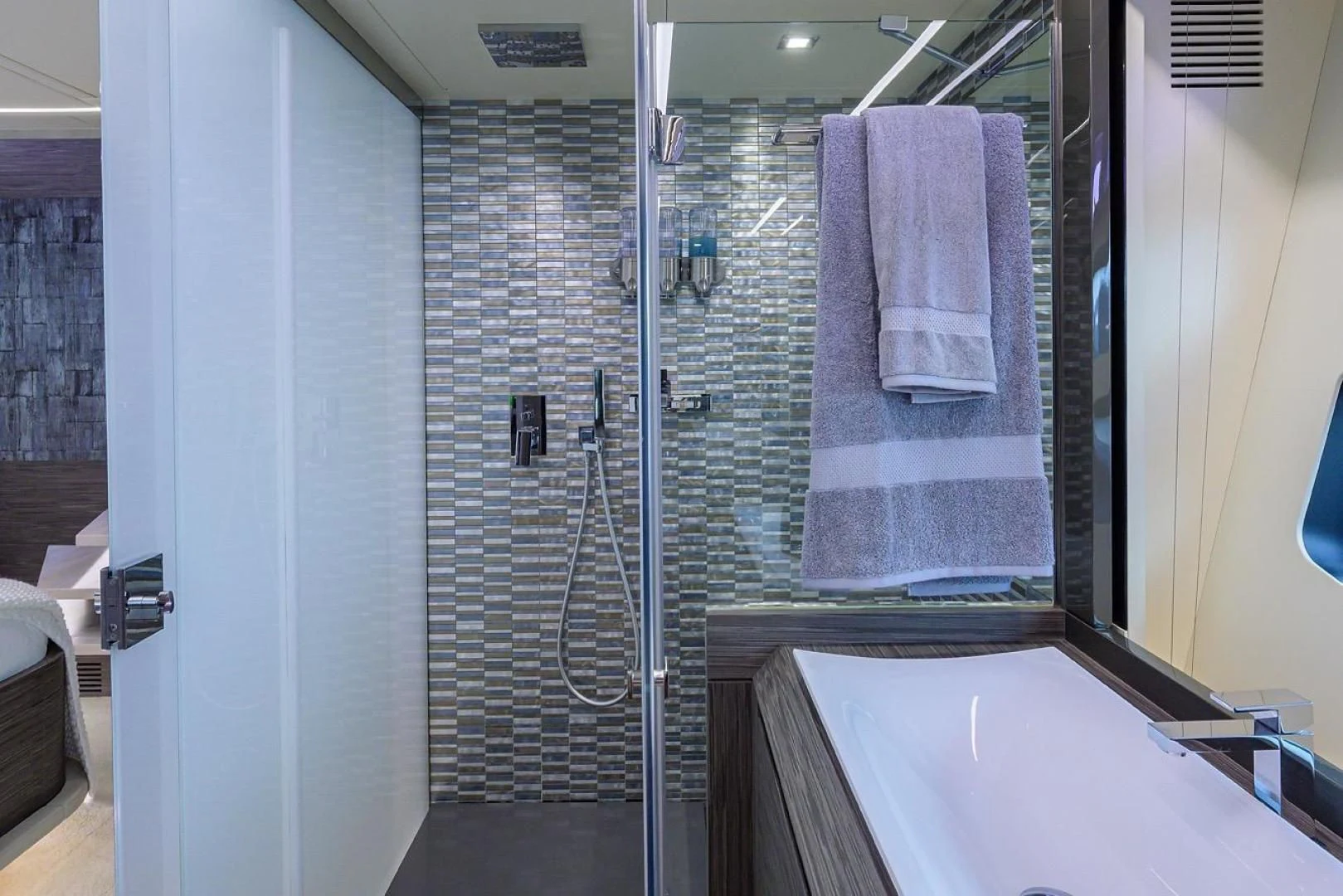 a bathroom with a shower unit aboard AFRICAN WILD DOG Yacht for Sale