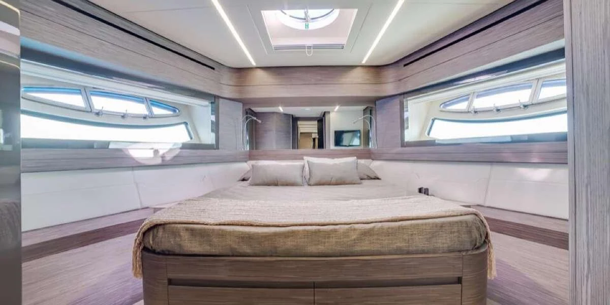 a bed in a room aboard AFRICAN WILD DOG Yacht for Sale