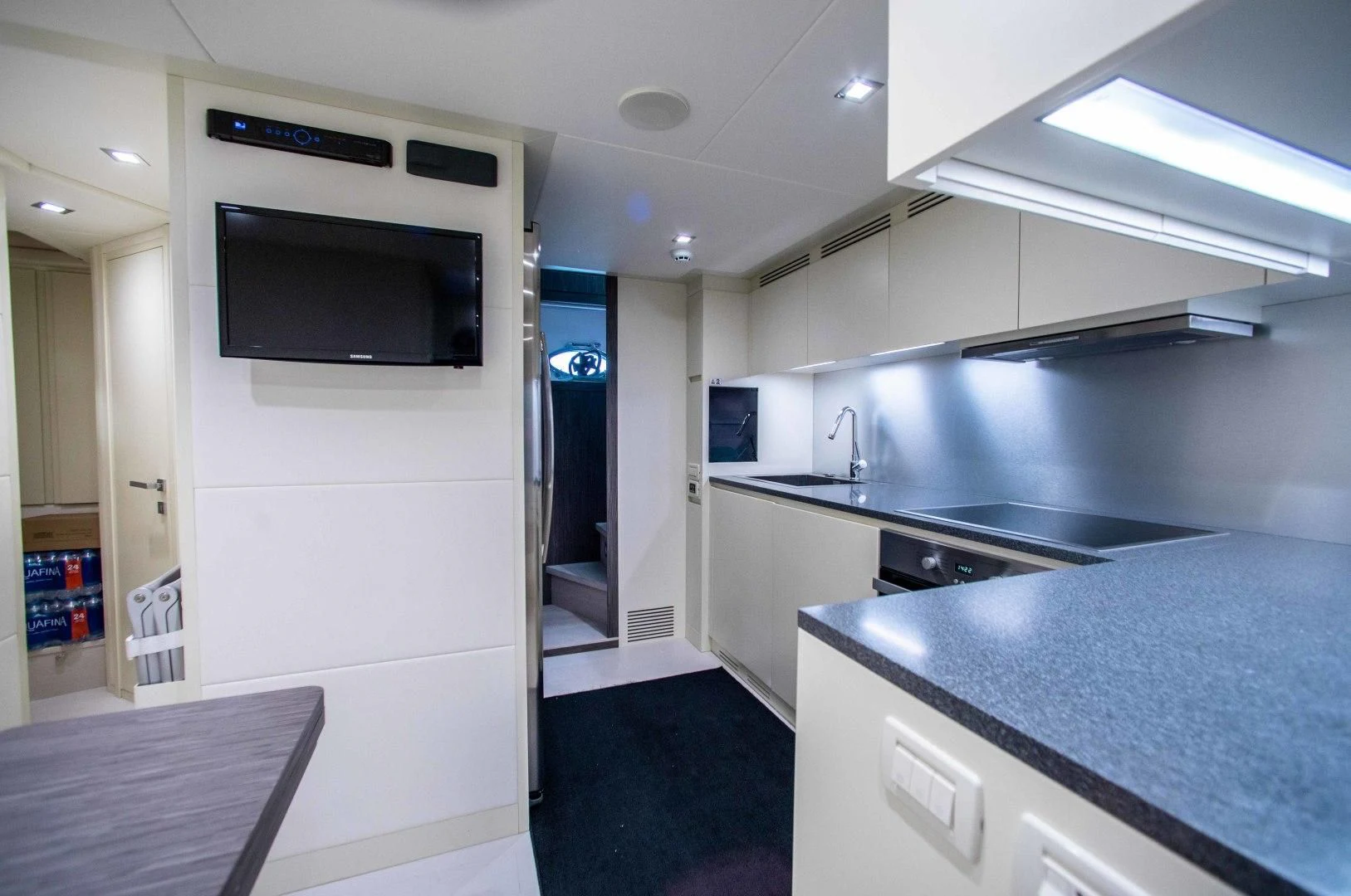 a kitchen with a microwave oven aboard AFRICAN WILD DOG Yacht for Sale