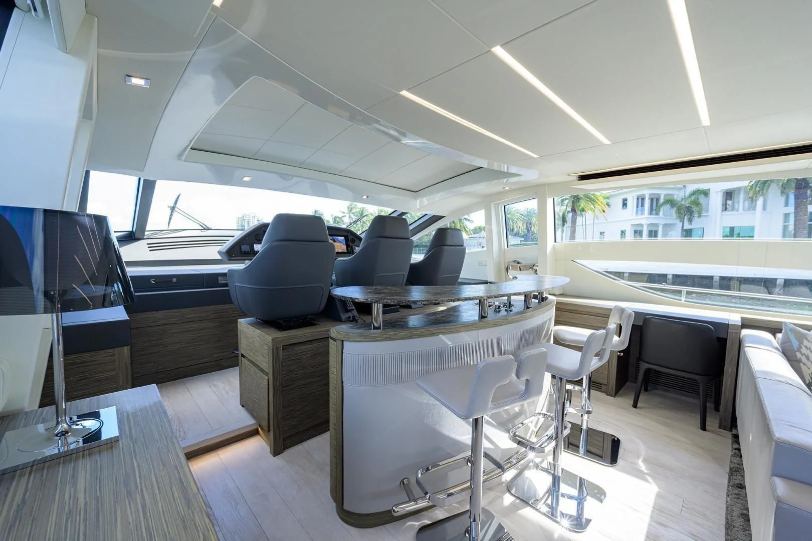 a room with a table and chairs aboard AFRICAN WILD DOG Yacht for Sale