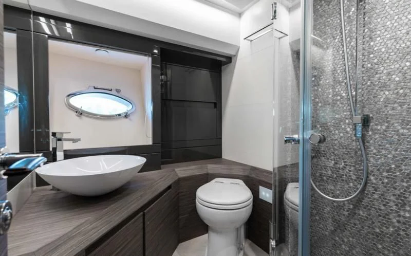 a bathroom with a sink and a toilet aboard AFRICAN WILD DOG Yacht for Sale