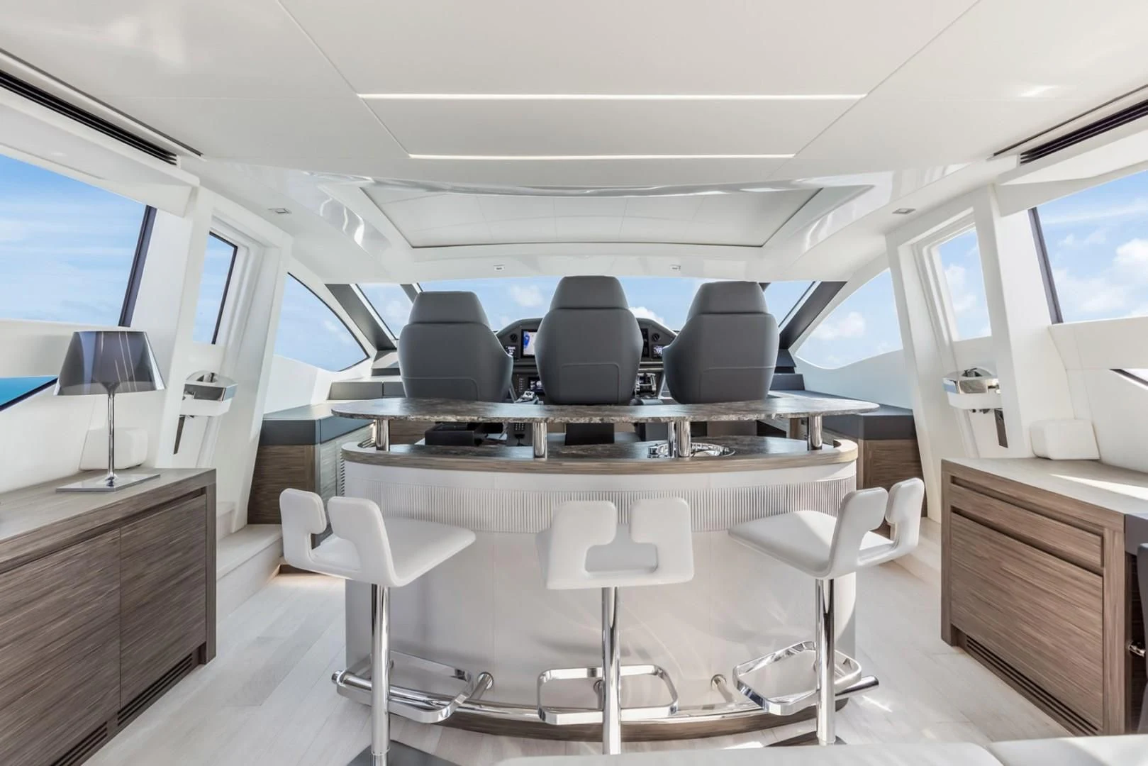 a room with a table chairs and a window aboard AFRICAN WILD DOG Yacht for Sale