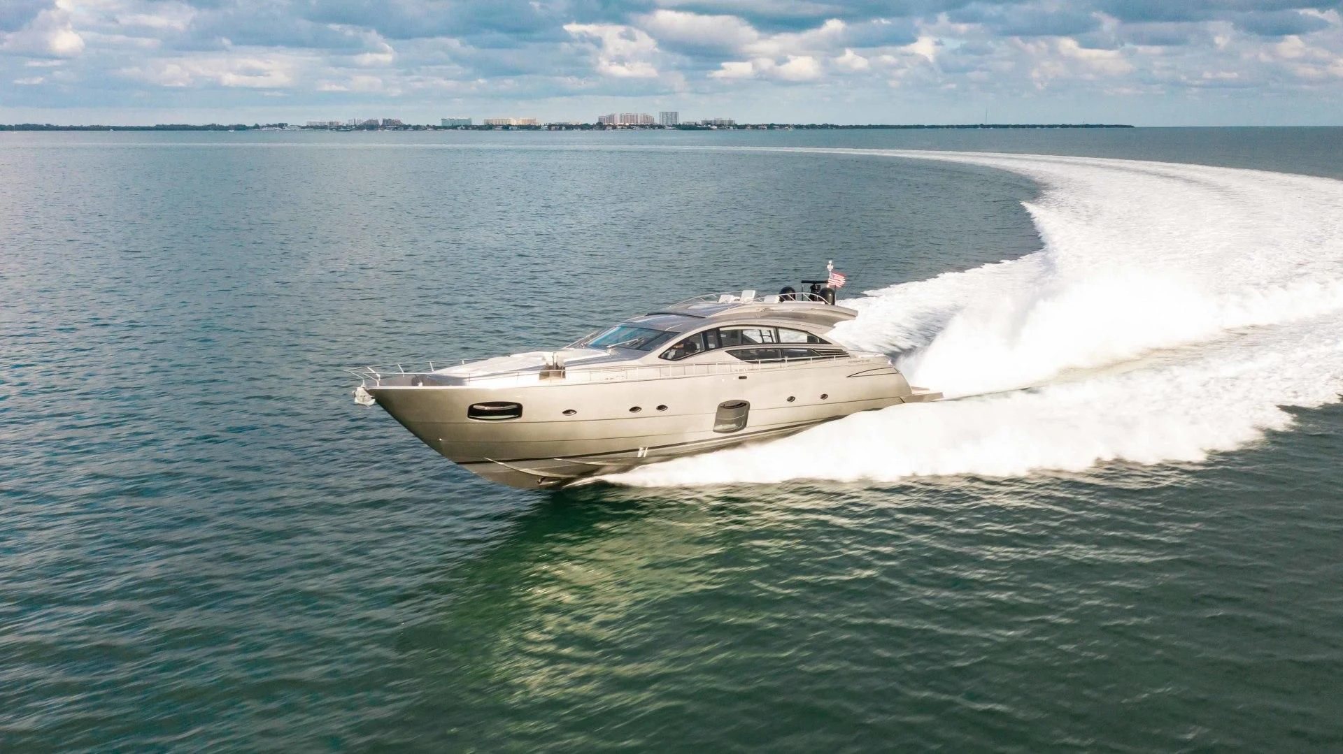 a white car driving in the water aboard AFRICAN WILD DOG Yacht for Sale