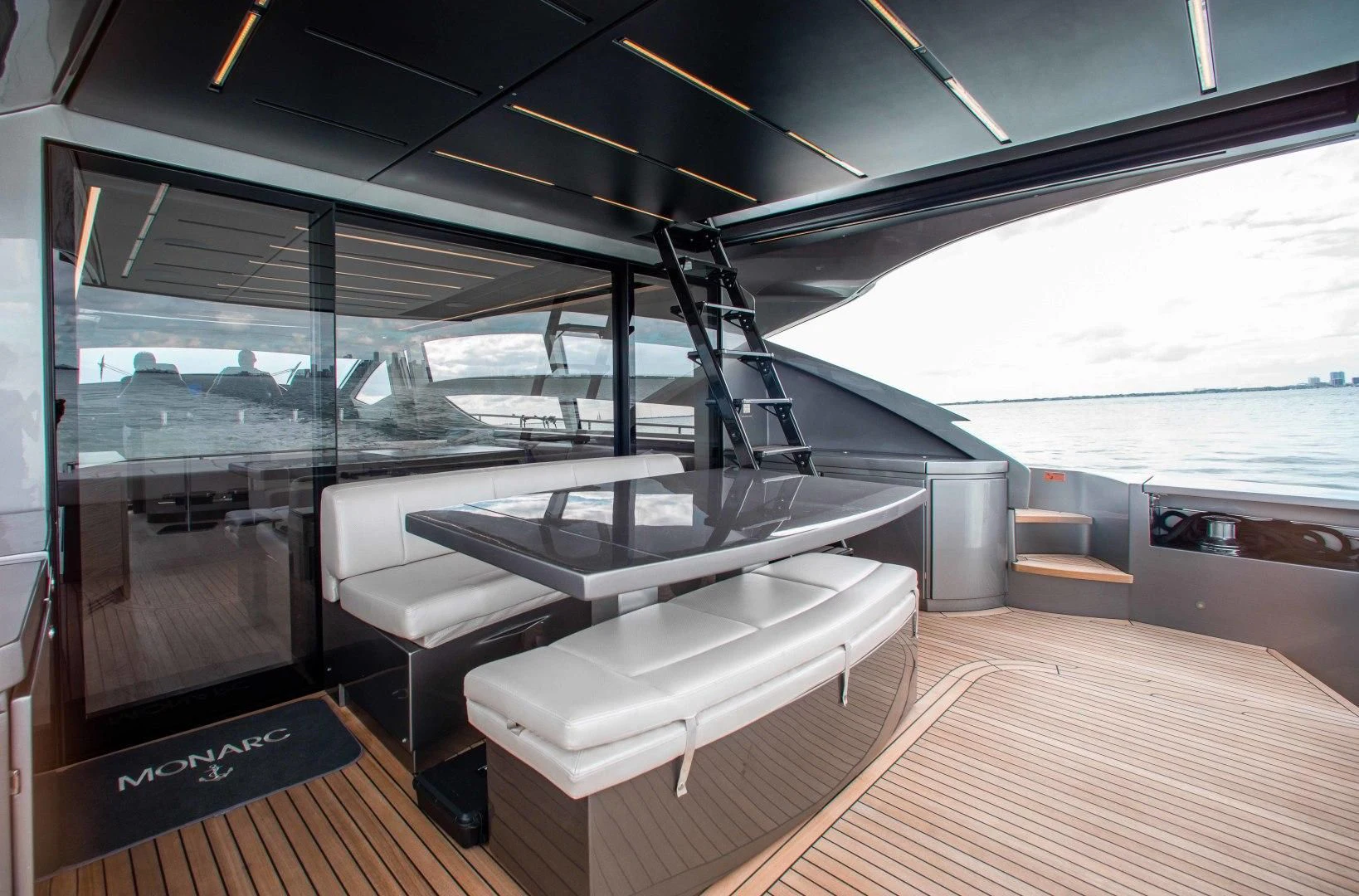 a room with a large bed and a large window aboard AFRICAN WILD DOG Yacht for Sale