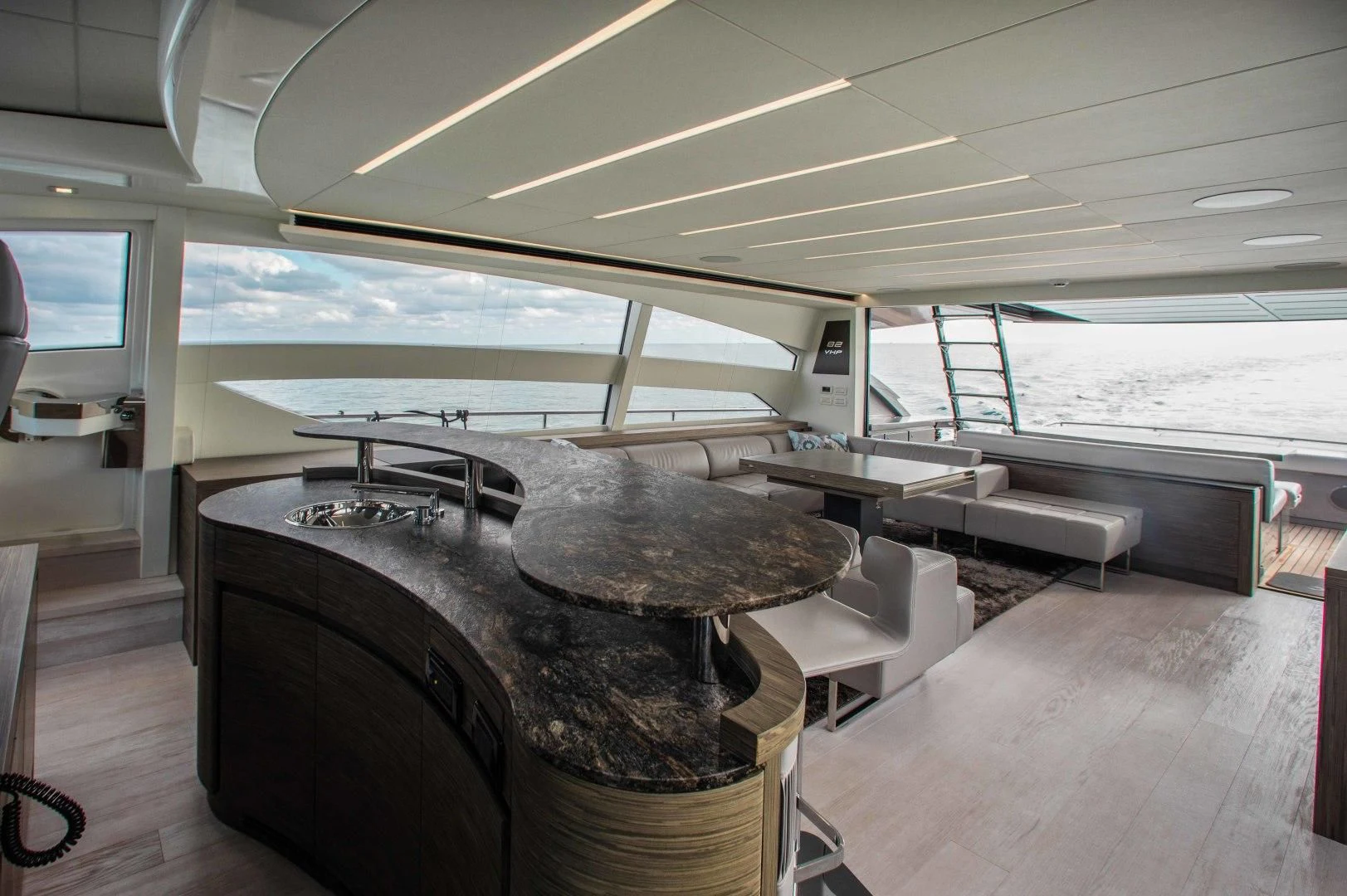 a room with a large window and a large tank on the side aboard AFRICAN WILD DOG Yacht for Sale