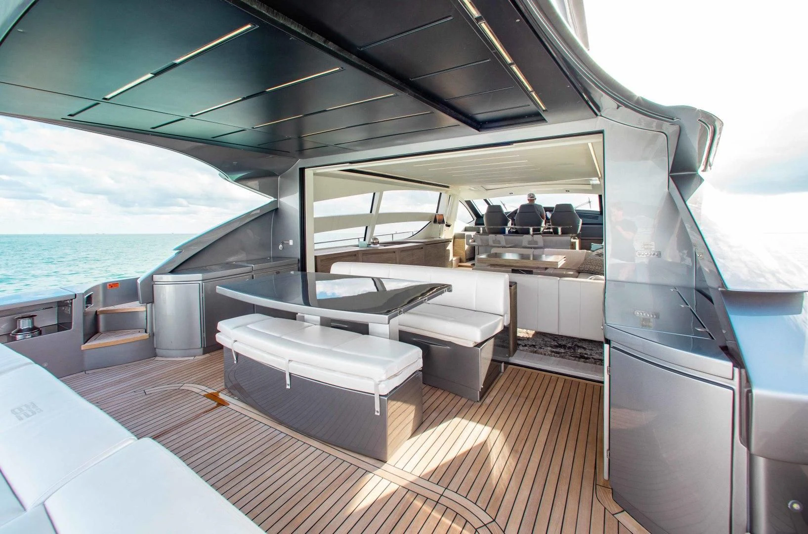 a boat with a desk and a table on it aboard AFRICAN WILD DOG Yacht for Sale