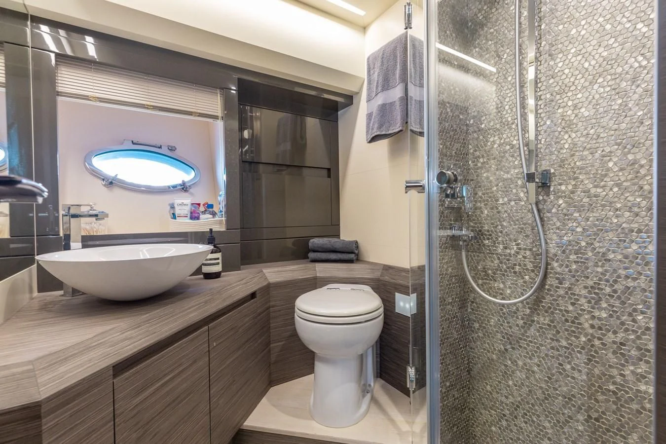 a bathroom with a large mirror aboard AFRICAN WILD DOG Yacht for Sale