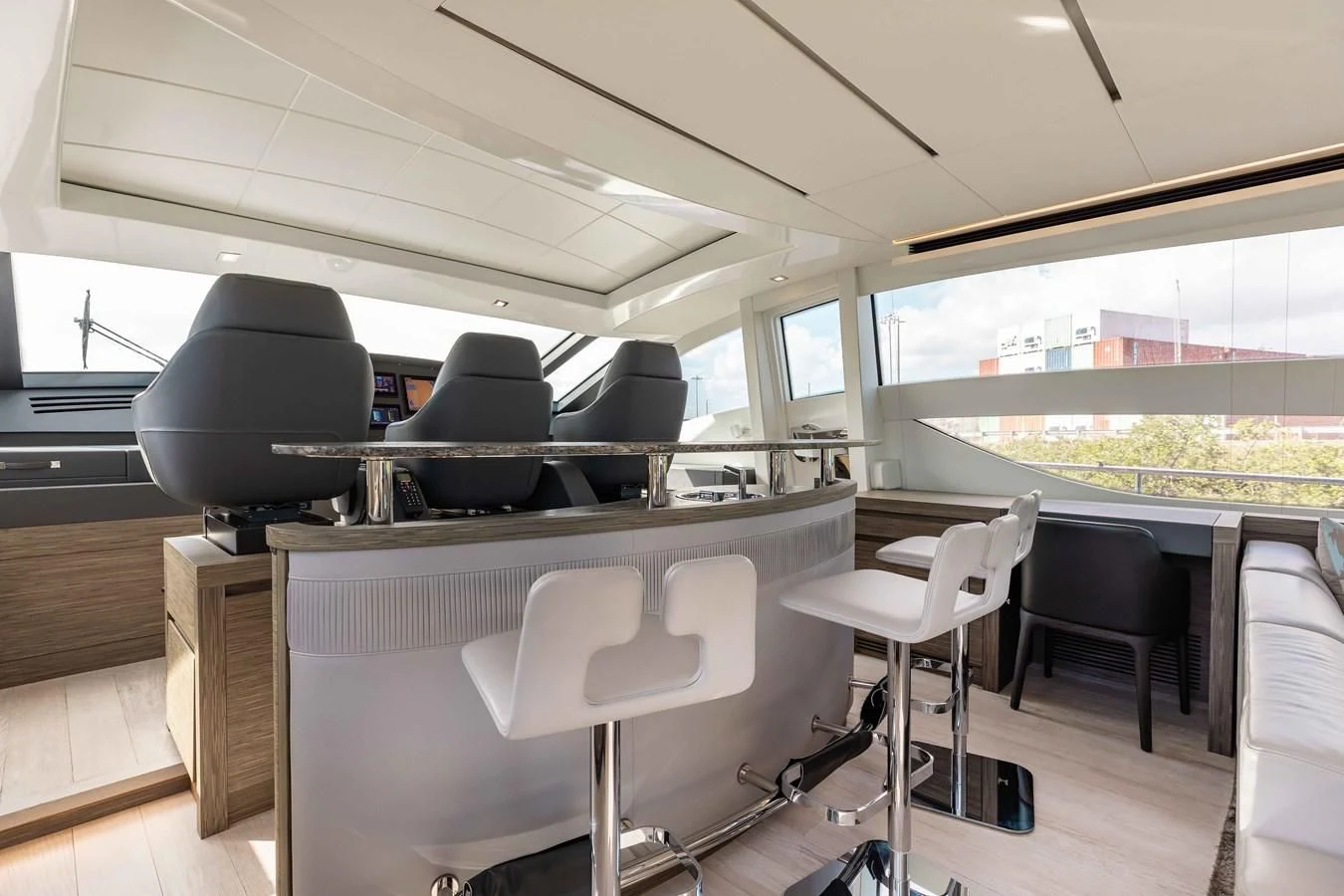 a room with a table and chairs aboard AFRICAN WILD DOG Yacht for Sale